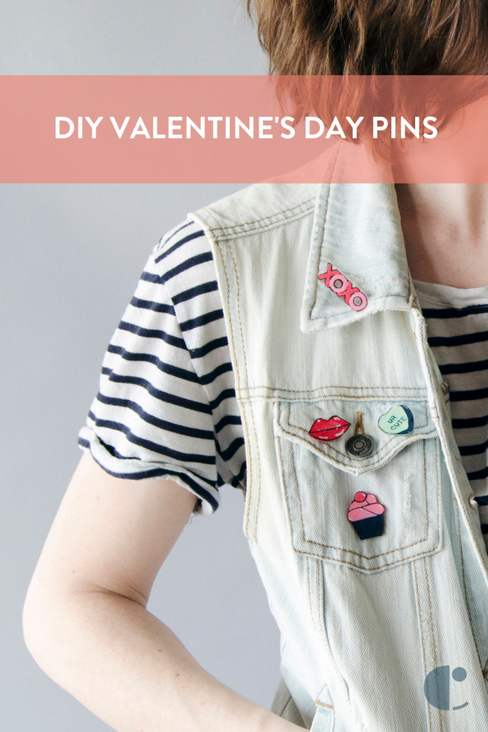 A denim vest with valentines on it.