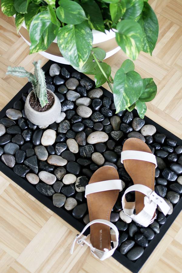 Pebble Bath Mat with shoes and plants