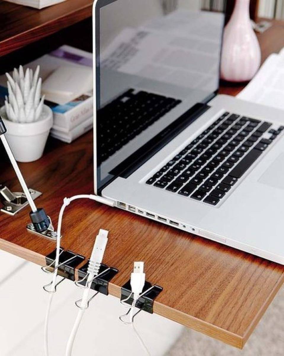 Binder clips are your buddies! Use them to hold cords in place along your desk | 72 Organization Tips and Projects for Every Space in Your Home