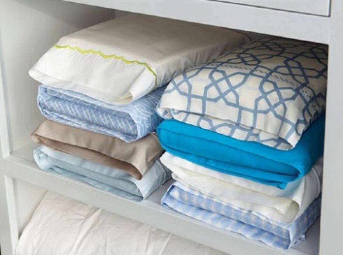Fold linen sets inside their matching pillowcases | 72 Organization Tips and Projects for Every Space in Your Home