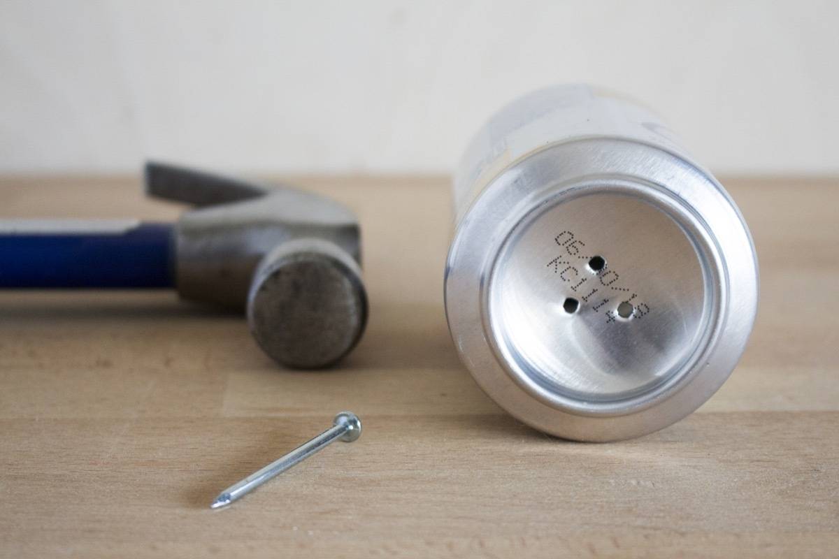 How to create drainage holes in the bottom of a can