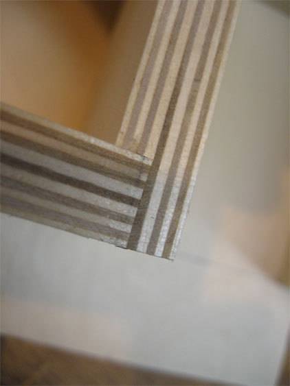 The edge of a white picture frame is shown.