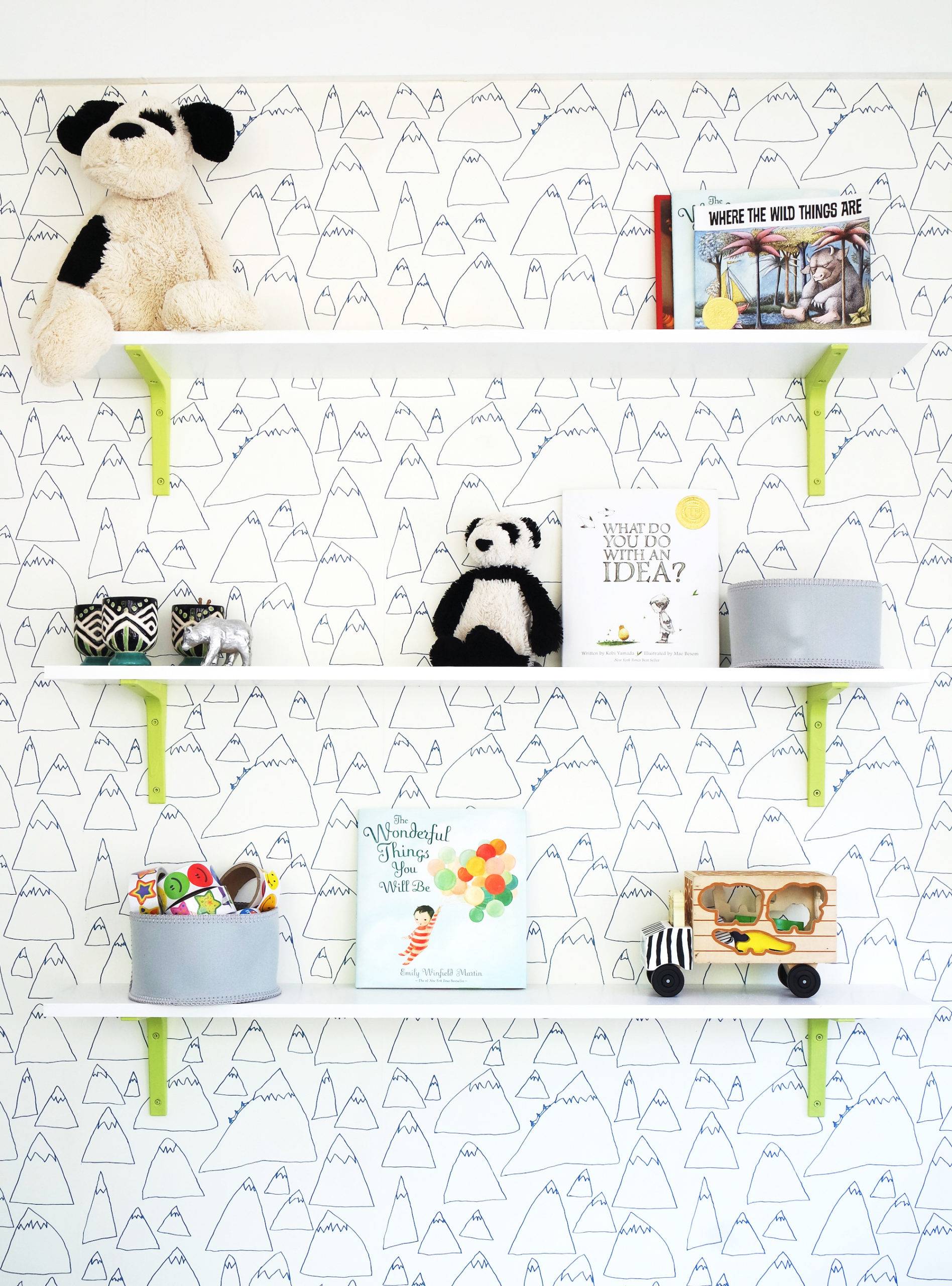 Pops of lime green pair will illustrative wallpaper create the perfect playroom. Click through to see the full reveal!
