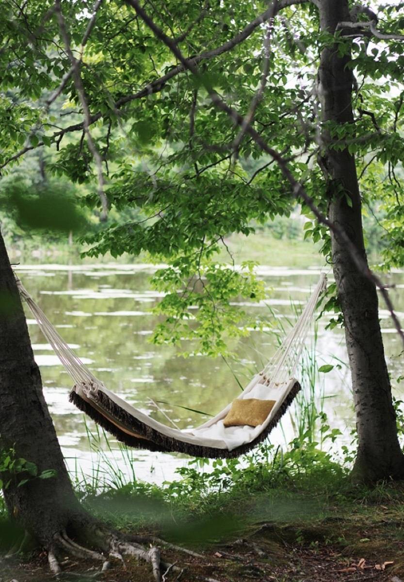 62 DIY Projects to Transform Your Backyard: Fringed hammock