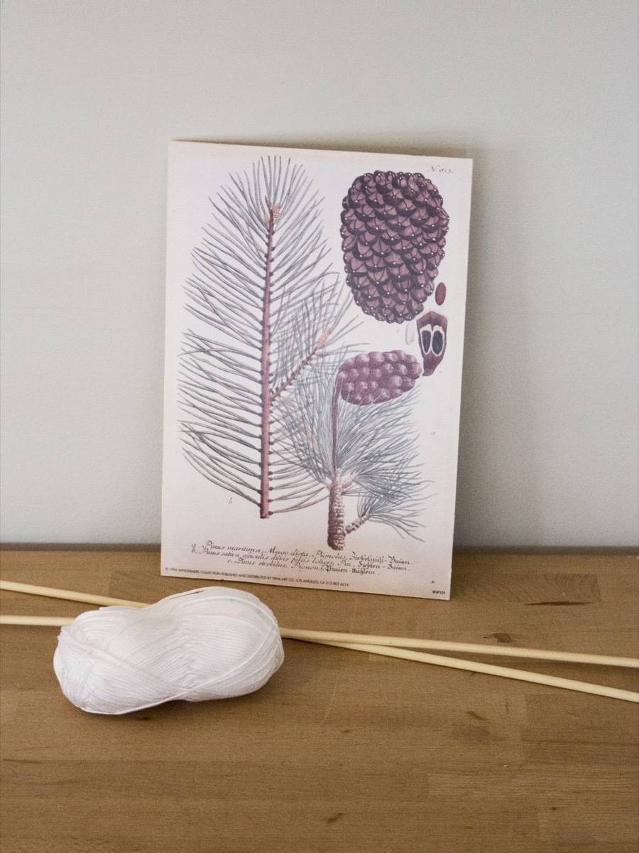 Using skewers and string to hang wall prints