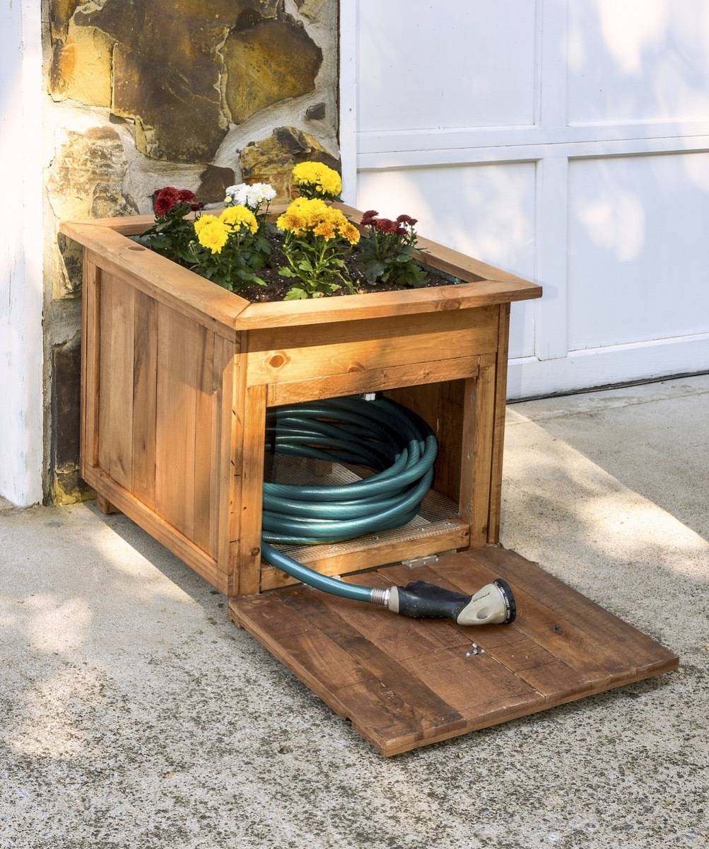 62 DIY Projects to Transform Your Backyard: Hose housing station with built-in planter