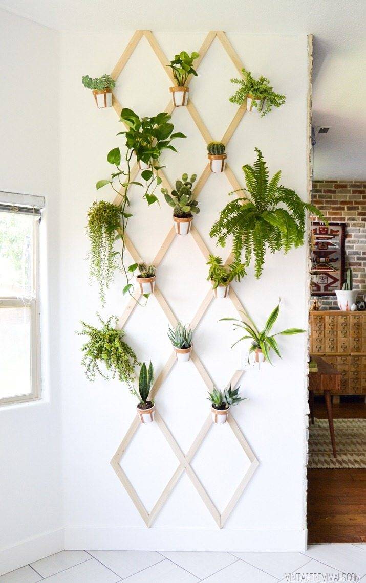 This vertical planter wall is a useful and practical wall decor idea