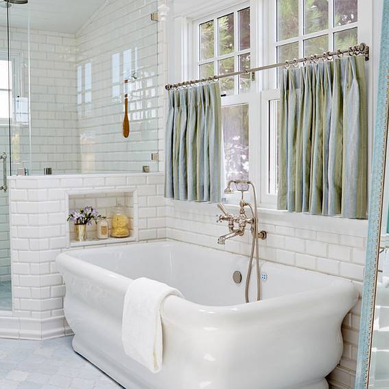 Window curtain panels near a bathtub or shower