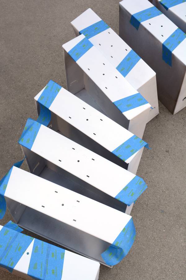 Blue and white colour boxes are lying next to each other in a row.