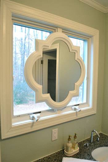 Hanging a mirror in front of a window near a sink