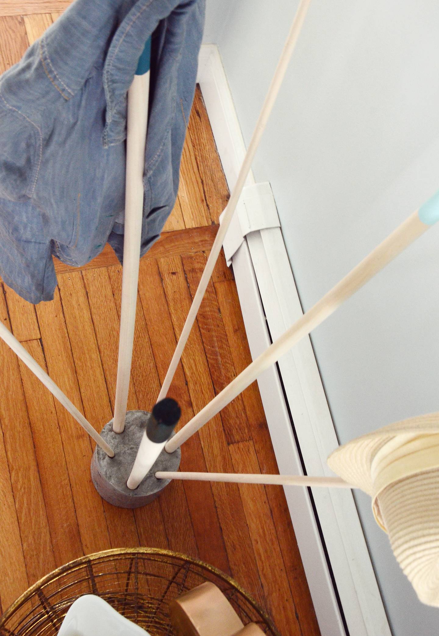 DIY coat rack made from cement and wooden dowels