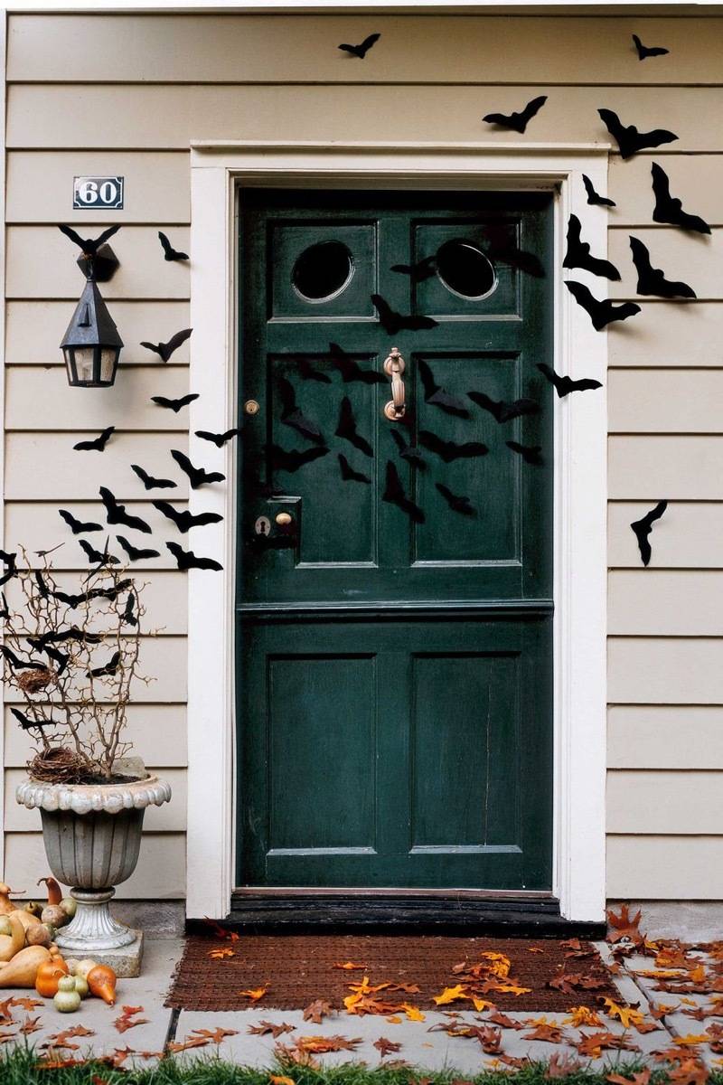 Flock of bats flying over front door