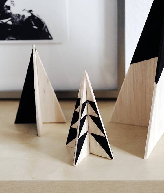You can assemble your wooden tabletop Christmas trees by sliding the grooves together