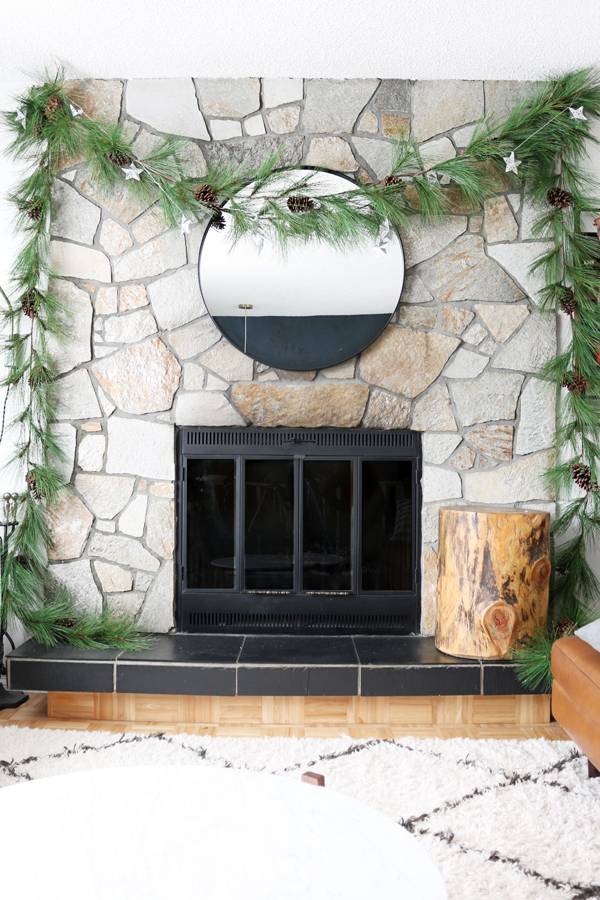 Fireplace garland: break it up by hanging a single piece that acts as a focal point.