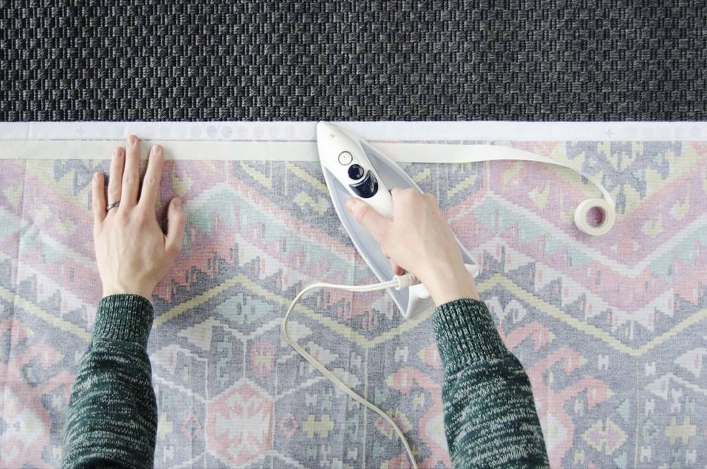 Use iron-on hem tape to make some inexpensive wall art!