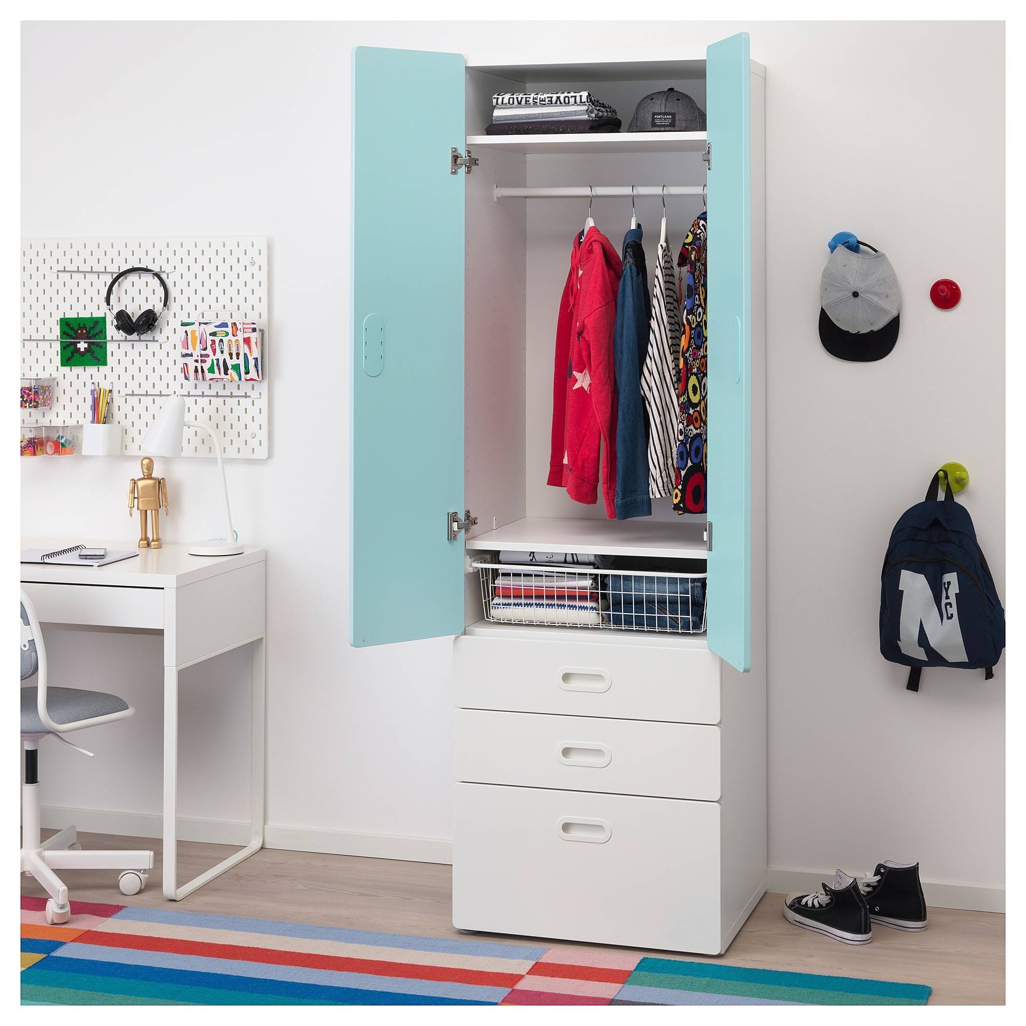 Blue and white wardrobe in colorful kid's room
