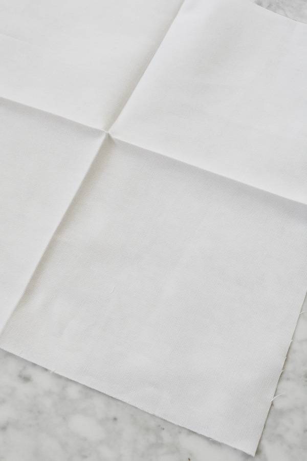 A white sheet of paper has been folded into fourths.