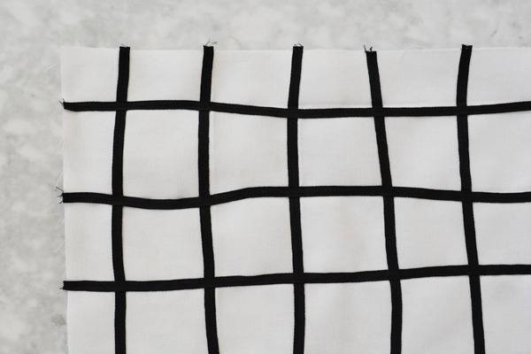 A grid is printed in black on a white paper.