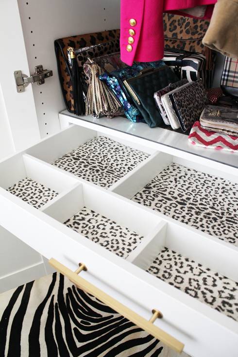 A large white drawer with leopard print interior.