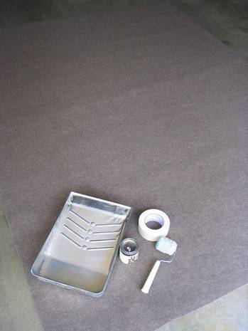 Objects for painting sitting on the floor of a house.