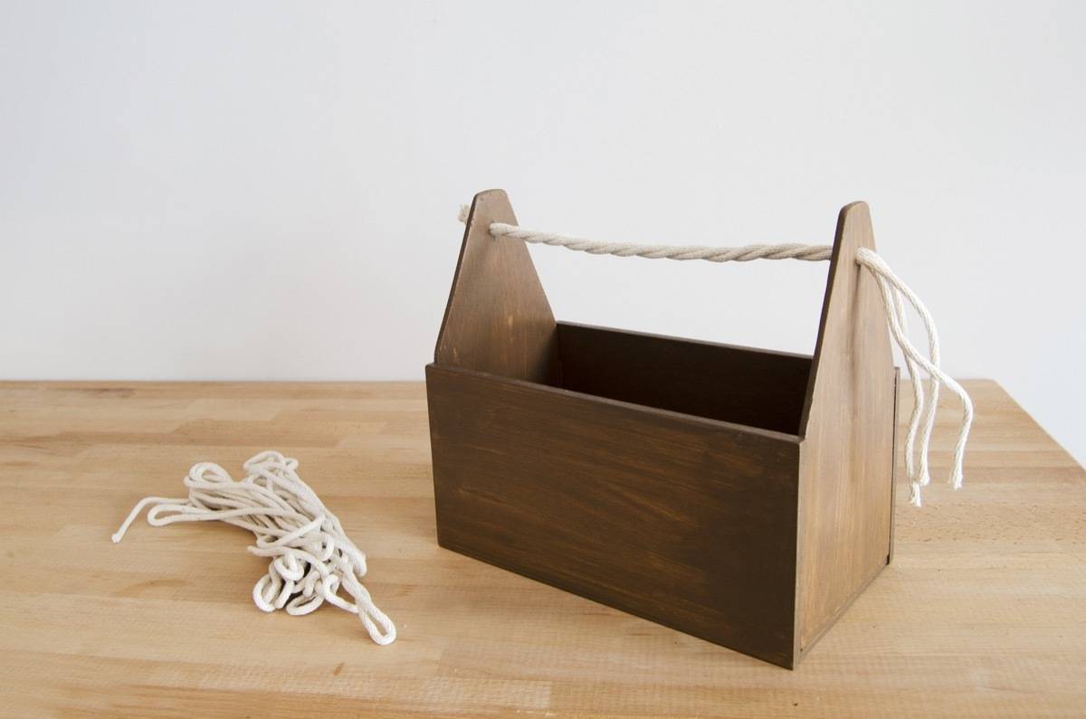 DIY Wood Cleaning Caddy: Stain, and thread with rope for a natural-looking handle.