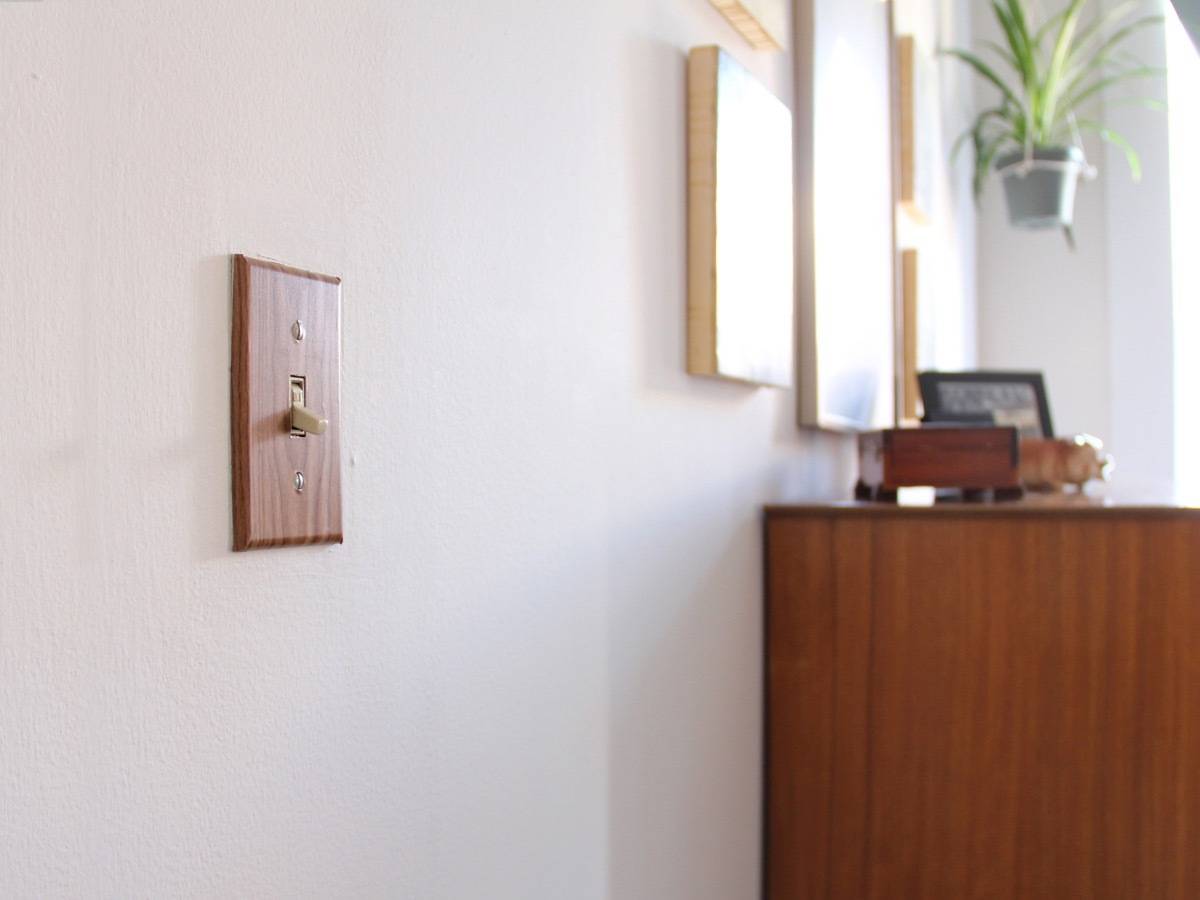 Landlord-friendly apartment upgrades: Decorate outlet and light switch covers using contact paper