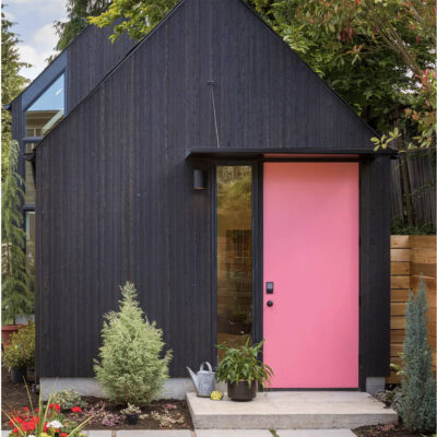 dark exterior with pink door