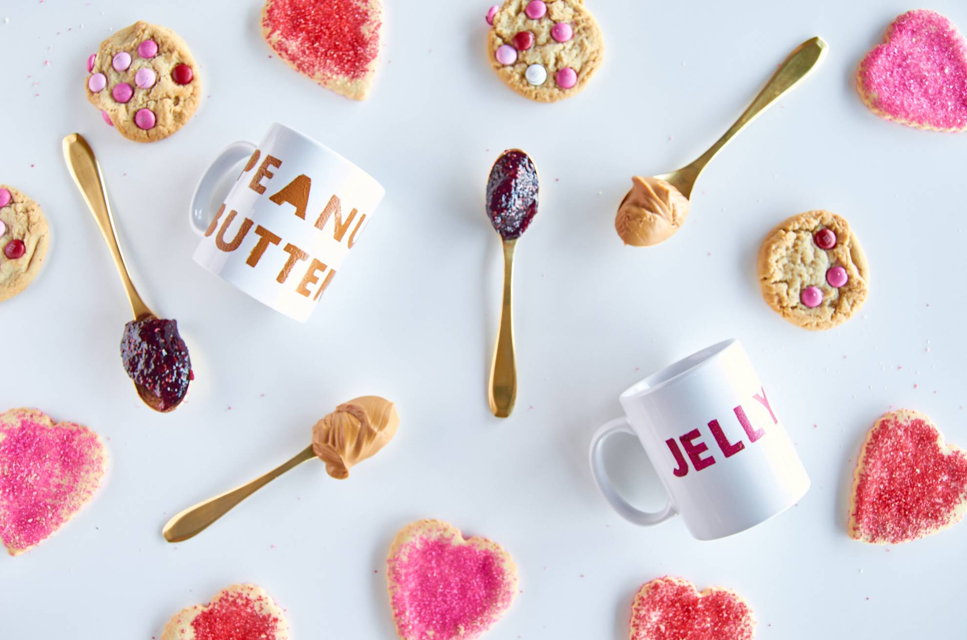 Different treats with peanut butter and jelly sit on a surface.