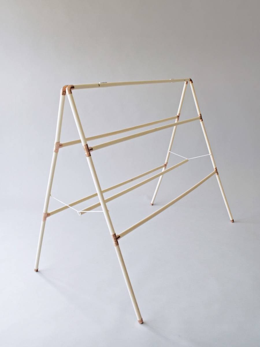 You don't have to be a master craftsman to make a clothes drying rack. All you need are some wooden dowels, copper pipe fittings, and glue!