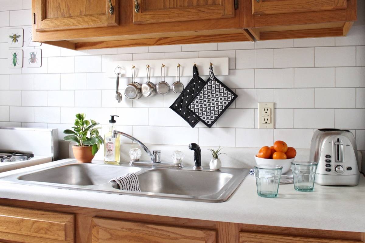 How to create a fake kitchen backsplash using temporary wallpaper.