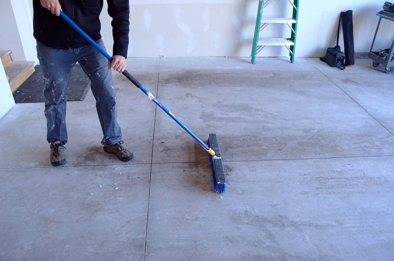 brush garage floor clean of debris before painting