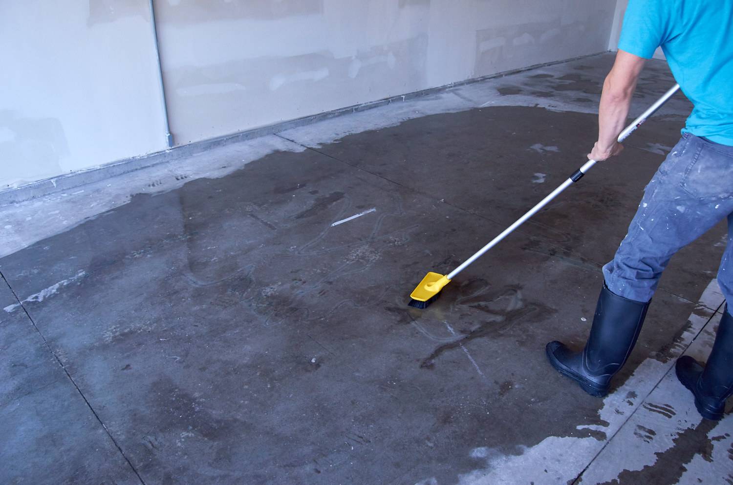 scrub concrete floor with mild detergent