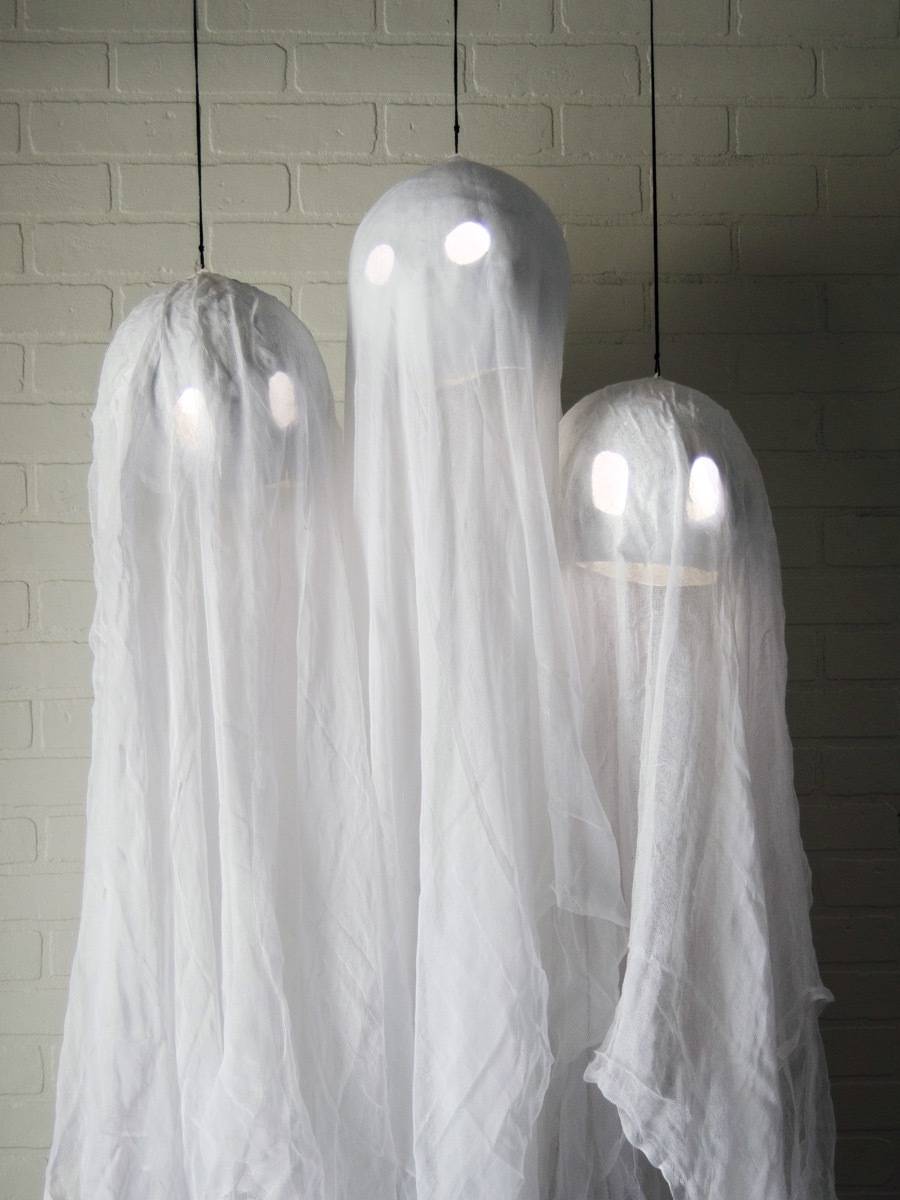 Hanging ghosts with suspended glow sticks inside