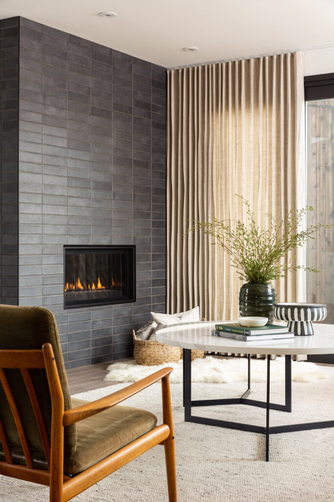 simple midcentury fireplace with gray tiles.