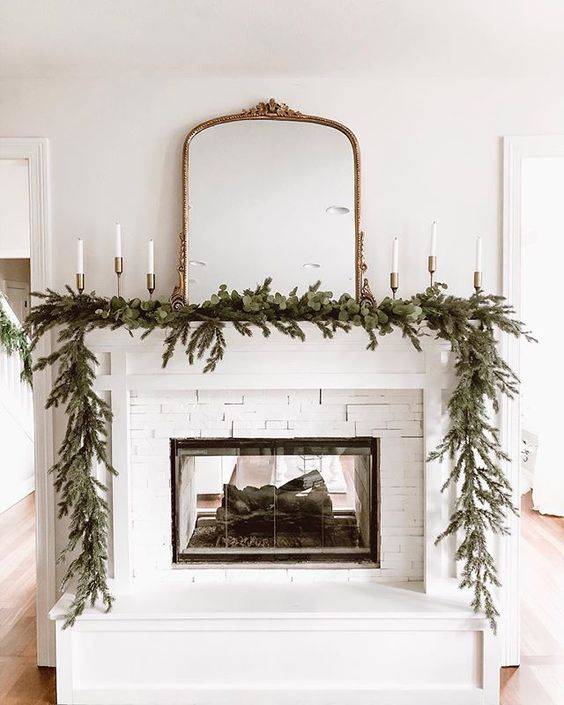 Classic white see-through fireplace with glass doors. Image: Grey Lane Homestead