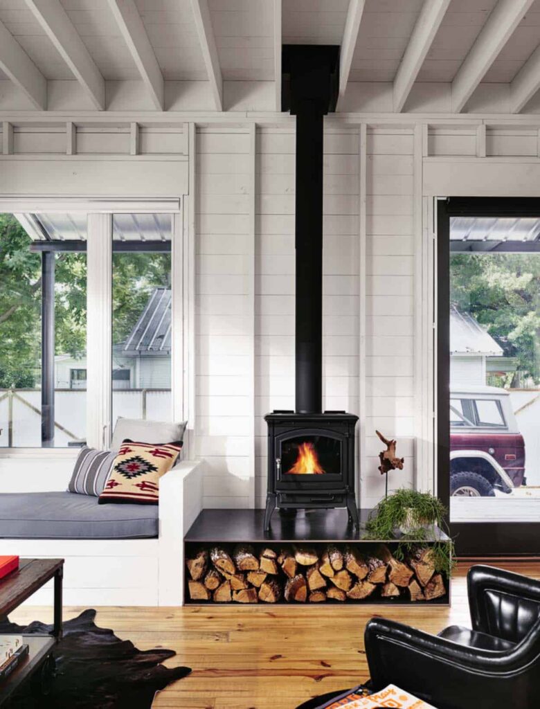 Clean, simple lines in this Scandinavian inspired wood-burning stove. Image: One Kin Design