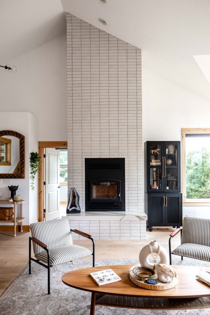 This mid-century modern fireplace add dramatic height to this living room.