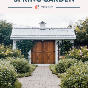 Spring garden pin with barn and flowering shrubs