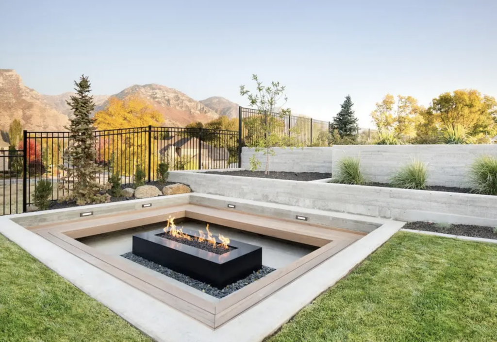 A sunken fire pit with built-in seating.