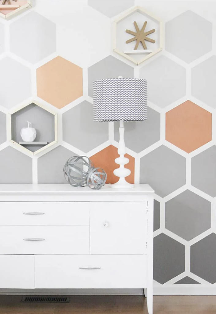 A gray and orange hexagon ombre wall from Thistlewood Farms.
