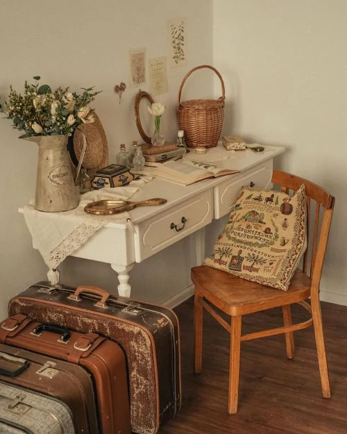 Desk nook with embroidered pillows, woven baskets, and vintage finds. Image from aesthetics.fandom.com.