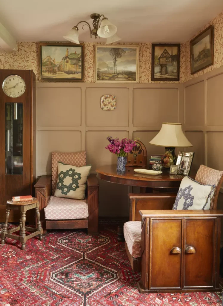 Vintage rug and floral wallpaper make this nook extra cozy. Image from Real Homes. 