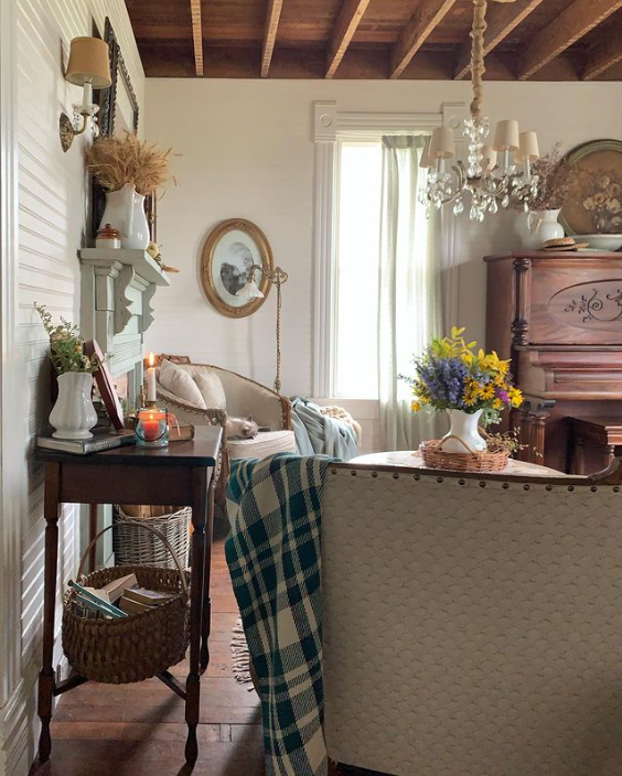 Fabric, texture, and plants bring cottagecore to this living room from Bryarton Farms. 