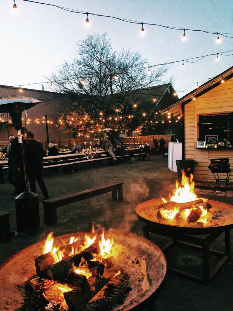 two backyard fire pits burning 