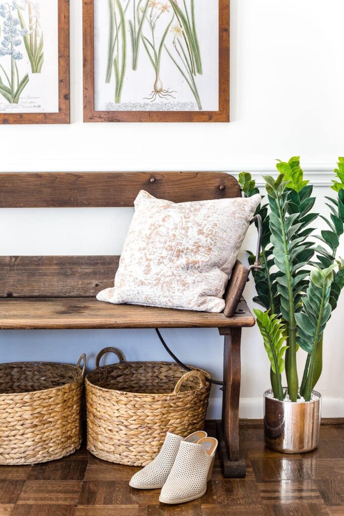 Another great entry bench and basket combo for stylishly storing shoes in your entryway. Image from the Blesser House.