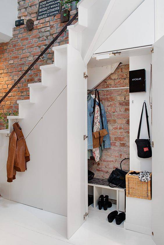 Under stairs coat closet