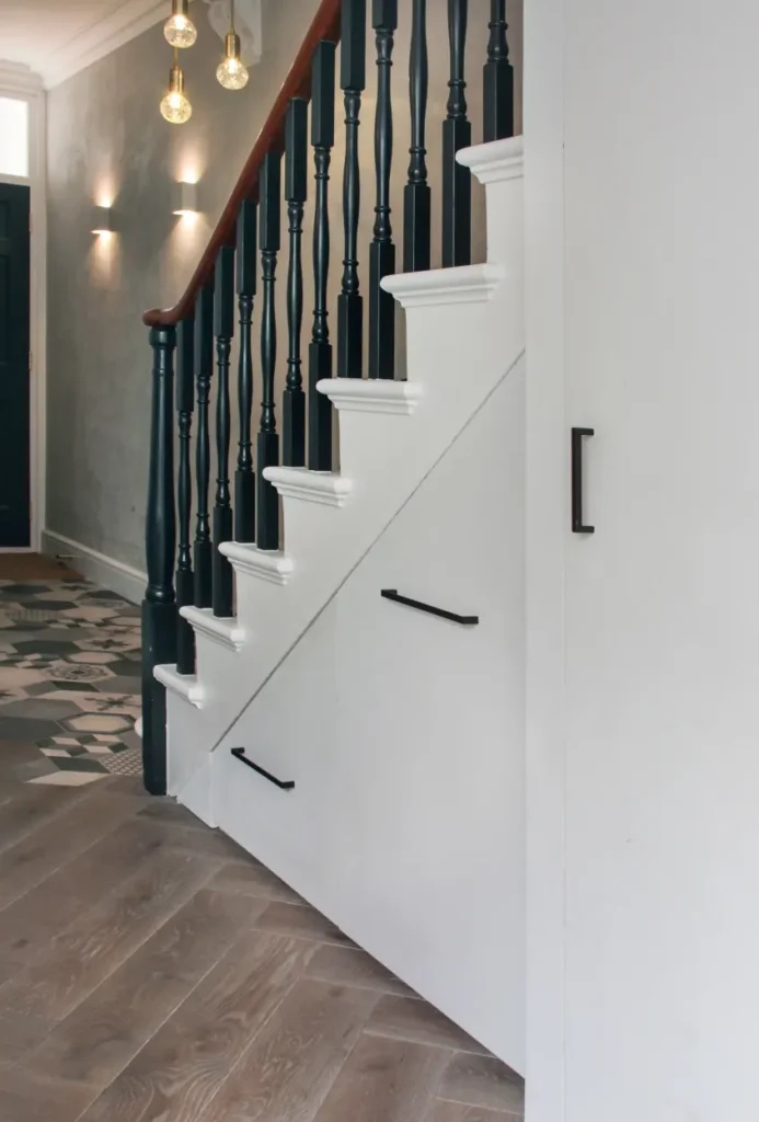 Under stair shoe drawers from Apartment Therapy.  Shoe storage under the stairs. Image credit: Kotomi Yamamura