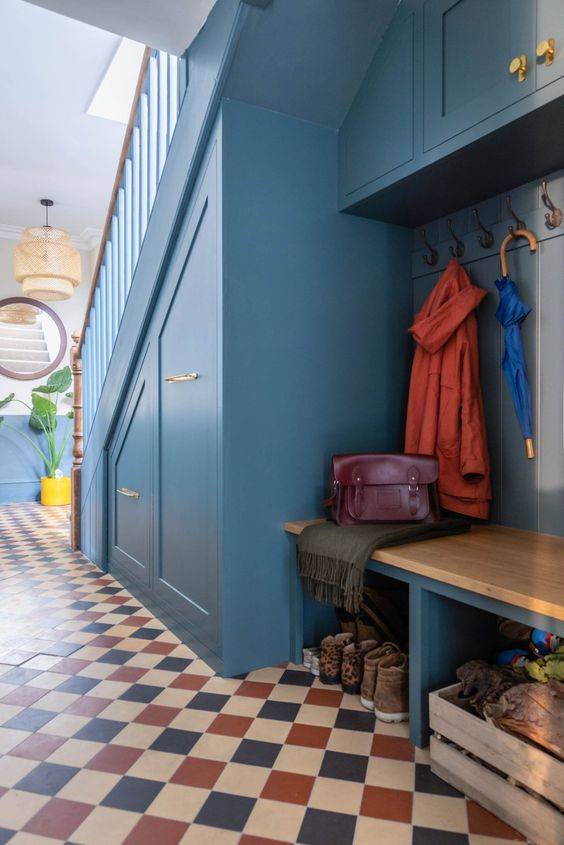 Drawers, hooks, and baskets! This under stair shoe storage solution from Frome Interiors has it all. 