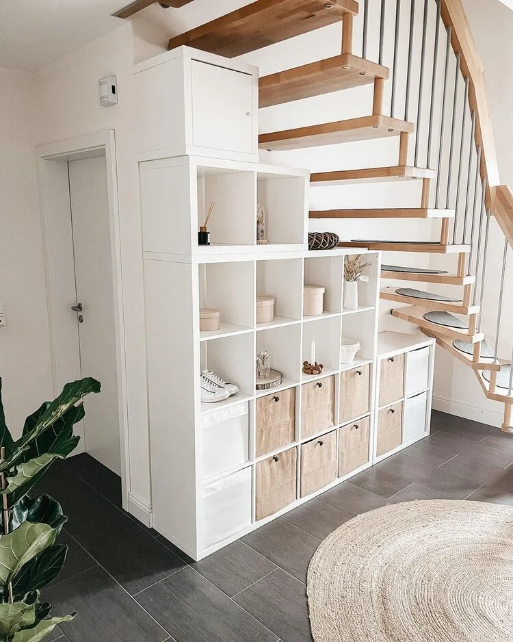 The essential IKEA KALLAX cubbies under the stairs from Liesa Maier.