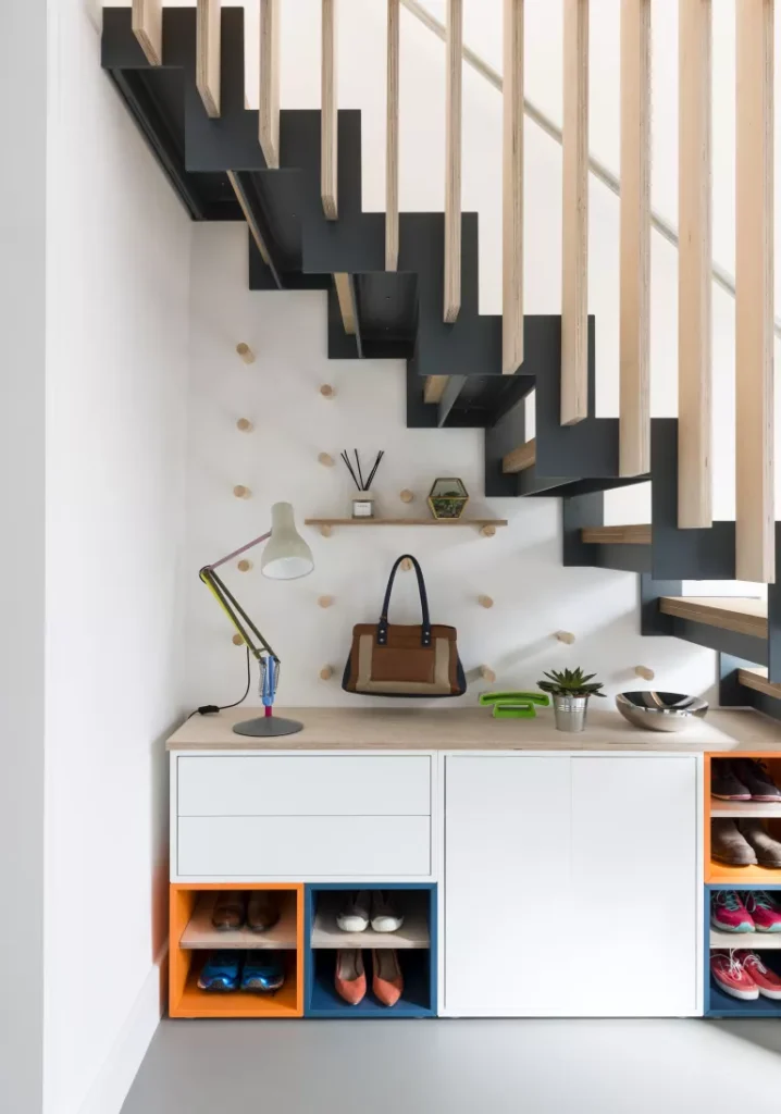 https://www.curbly.com/wp-content/uploads/2023/05/shoe-storage-under-stair-09-718x1024.webp